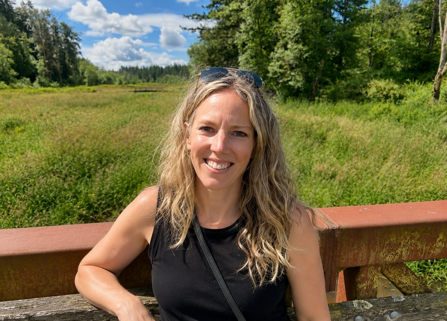 Jill outdoors in a sunny green field